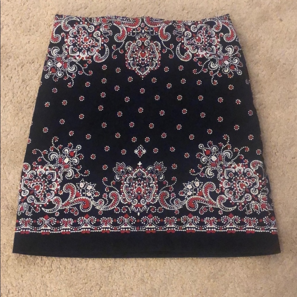 Cute black skirt with red and white pattern.